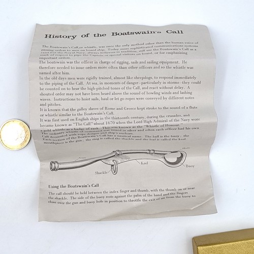 976 - A good Boatswain's whistle on a suspension chain length 120cm, item comes with history leaflet, encl... 