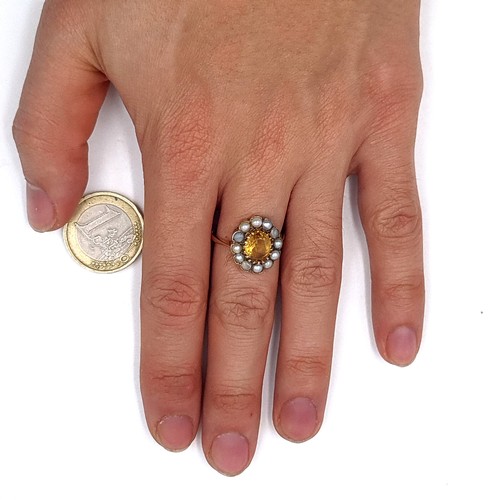 601 - A fine quality 9K gold citrine stone ring with a cultured pearl surround, hallmarks for London, size... 