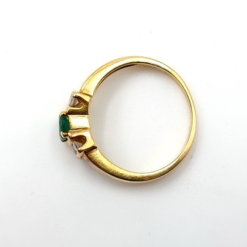 26 - Star Lot : A beautiful 18K emerald stone set diamond ring with wide band shoulders, ring size J, wei... 