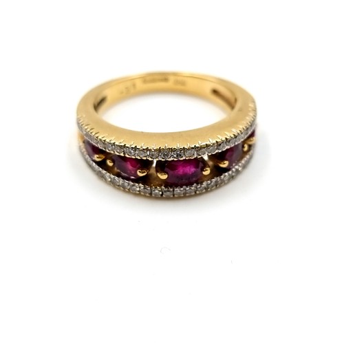 44 - Star Lot : A very handsome heavy top quality  18K gold wide band ring, set with beautiful rubies wit... 