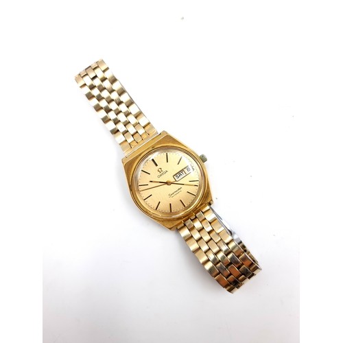 585 - Star Lot : A fine Omega vintage 1979 automatic wristwatch, set with gold metal case and dial with ba... 