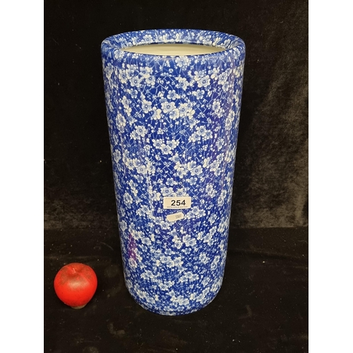 254 - Vibrant blue-and-white floral-patterned Umbrella stand, showcasing a timeless aesthetic appeal. In s... 