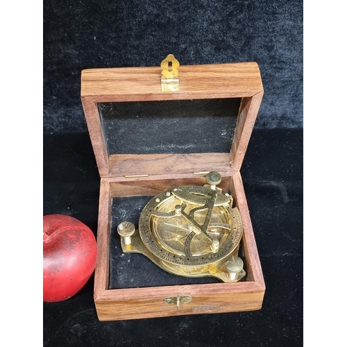 266 - Ornate brass astrolabe compass with wooden storage box, blending scientific history with aesthetic a... 