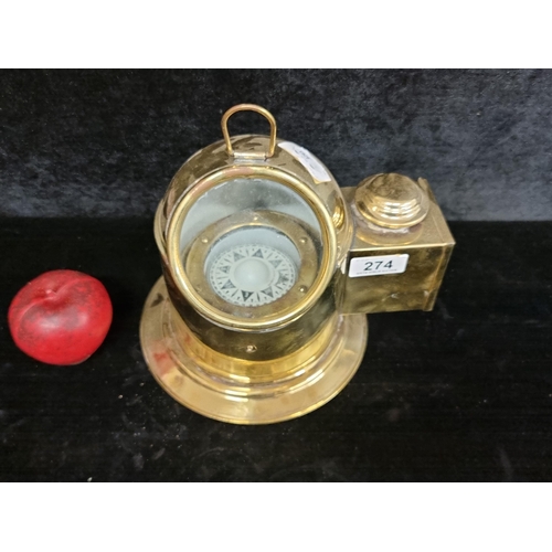 274 - A ship binnacle with a compass housed in a brass case with a moving display for easy reading during ... 