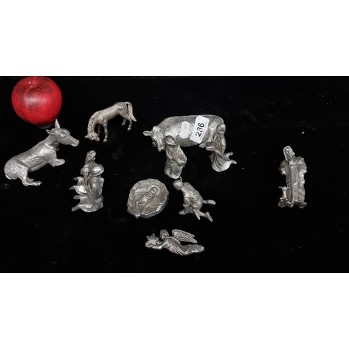 286 - A wonderful collection of eleven miniature pewter nativity figurines.