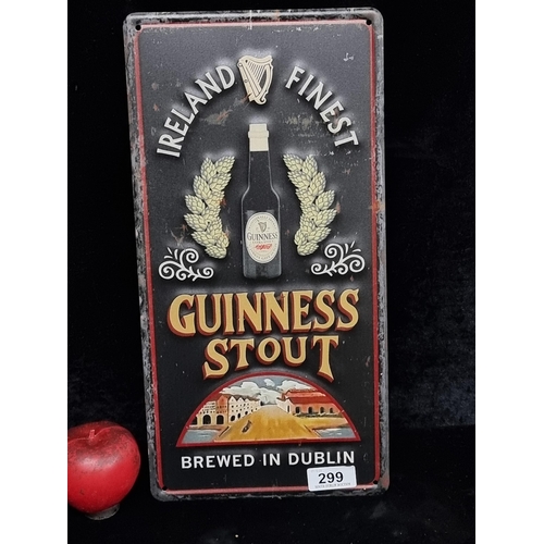 299 - A cast metal Guinness advertising wall sign.