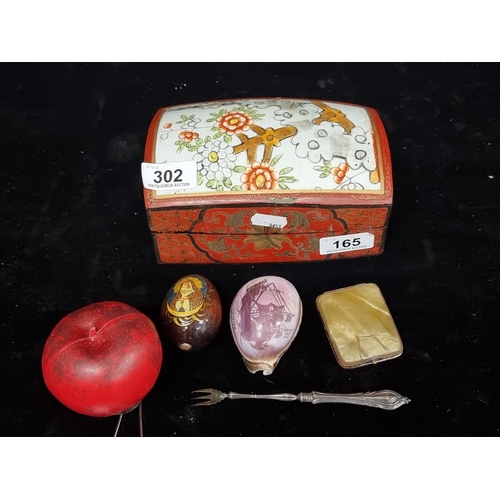 302 - A beautiful floral box containing a Virgin Mary hand painted wooden egg and a Godshill souvenir shel... 