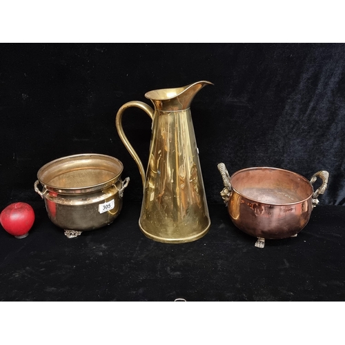 305 - Three items including a brass pitcher jug by J.S & S and two planters including a copper and brass e... 