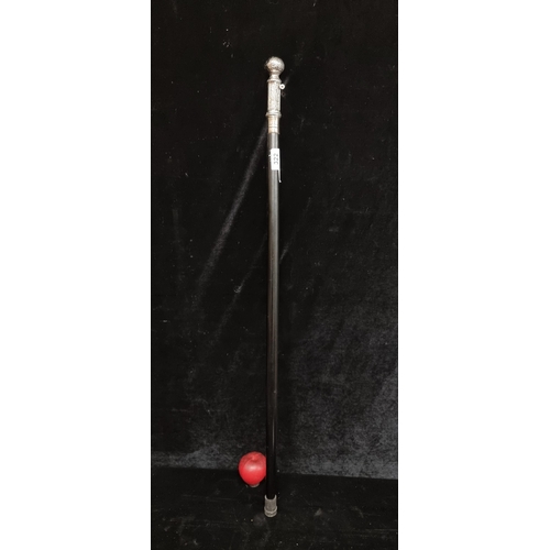 322 - Timeless ebony walking stick featuring a white metal topped handle.