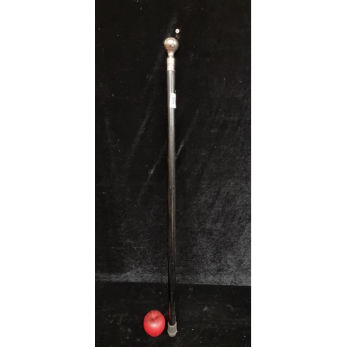 325 - A stylish ebonized gentleman's walking cane with a silver toned ball top.