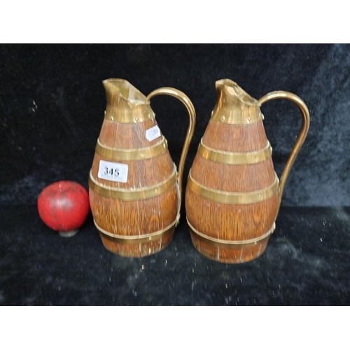 345 - A great pair of 1930s French made brass-bound oak pitchers, perfect for the discerning collector or ... 