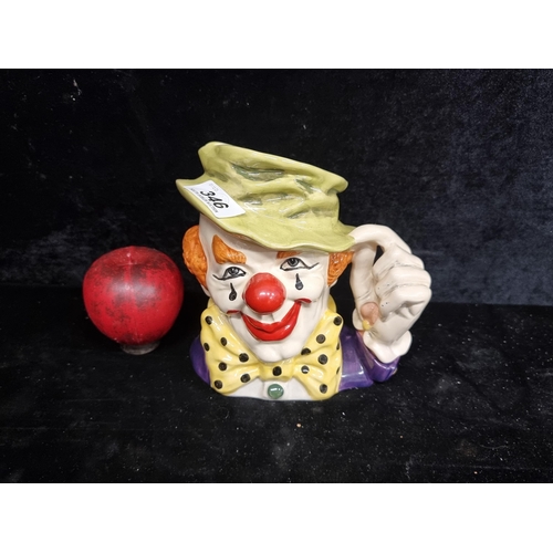 346 - Whimsical Royal Doulton 'The Clown' large toby jug with vibrant colours and a playful design, invoki... 