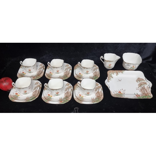 357 - A lovely Art Deco 21 piece tea set from Delphine china in the 'Woodland' pattern. Comprising of a sa... 