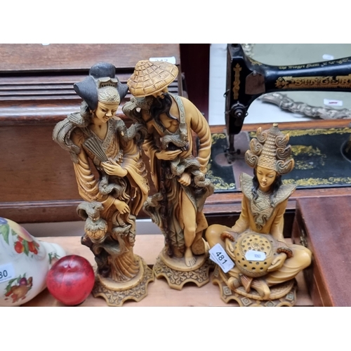 481 - Three vintage  Intricate Asian figurines, expertly crafted from resin, depicting traditional scenes ... 