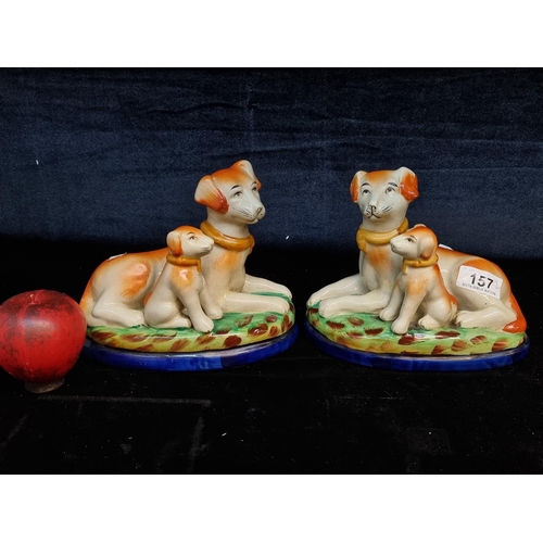 157 - Two charming late 19th century Staffordshire  flatback Jordan 1897 Tout-Court pottery dog figures wi... 