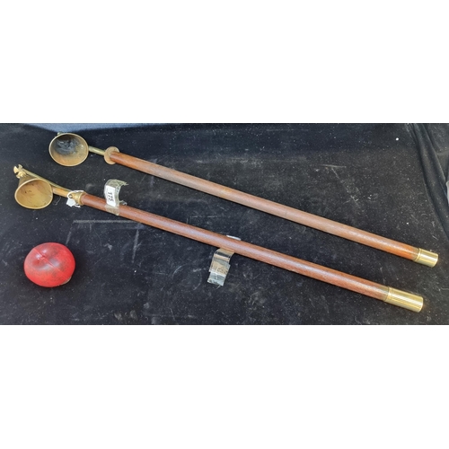 175 - Two wonderful antique long ecclesiastical candle snuffers with brass heads and wooden handles. L82cm