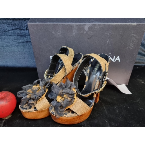 229 - Star Lot: A stylish pair of Dolce & Gabbana platform heel sandals with genuine leather straps, a che... 