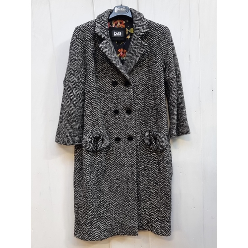 234 - Star Lot - A superb brand new ladies Dolce & Gabbana double breasted herringbone tweed coat with inn... 