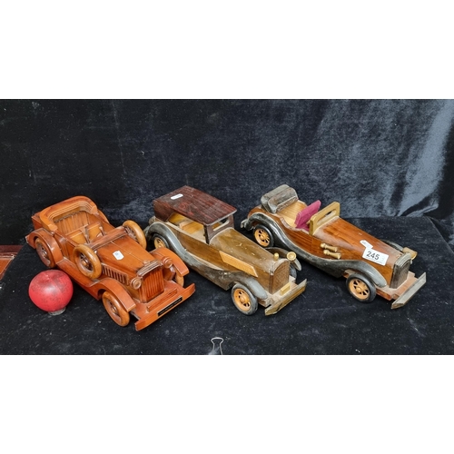 245 - A fabulous trio of large wooden model cars including a 1933 Packard twelve.