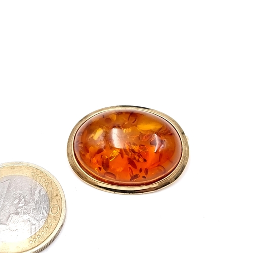 509 - Star Lot : A hallmarked 9K gold amber brooch , pin intact, weight 5.84 grams. Lovely brooch with lot... 