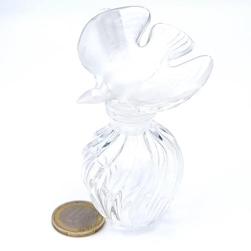 520 - A cut glass swirl design perfume bottle by lalique set with a bird design stopper. dimensions 9cm x ... 