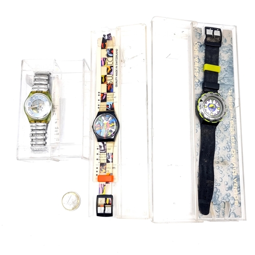 523 - A collection of three unopened Swatch watches, as per photograph.