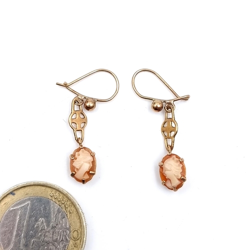 525 - A pair of vintage unusual  drop pendant 9K gold cameo earrings suitable for pierced ears, total weig... 