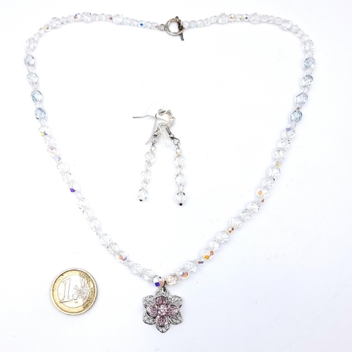 529 - A very pretty crystal cut beaded necklace with gem set floral pendant, length 44cm together with a p... 