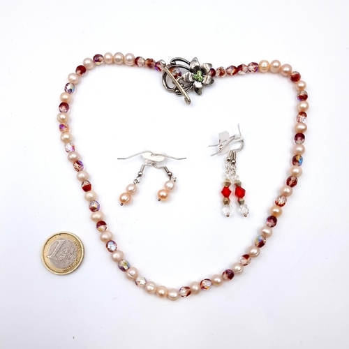 530 - A pearl and crystal necklace set with attractive floral t-bar clasp, length 40cm together with two p... 