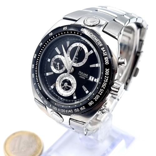 544 - A Pulsar chronograph watch, water resistant to 100m, set with luminous baton dial and luminous hands... 