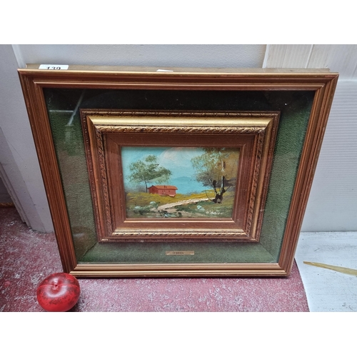 139 - A lovely original oil on board painting featuring a charming landscape scene of small terracotta hom... 