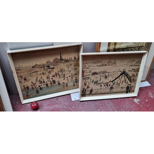 140 - A pair of vintage prints on board of works by the artist L. S. Lowry, housed in cream wooden frames.