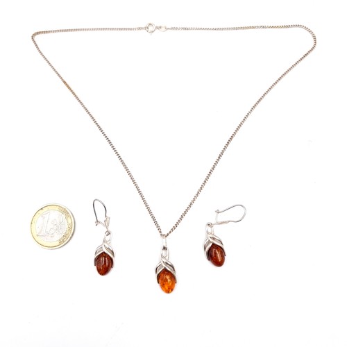 549 - A beautiful suite of Sterling Silver Amber jewellery, comprising of a lovely pendant sterling silver... 