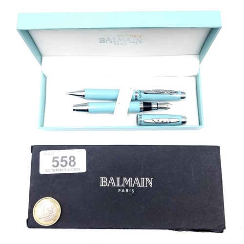 558 - Star Lot : A writing set by Balmain Paris consisting of a Fountain pen and biro with turquoise body ... 