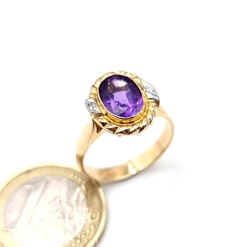 559 - Star Lot : An outstanding 14K gold stamped to band amethyst and diamond ring with scroll relief moun... 