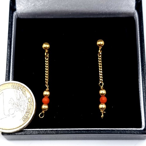 562 - A pair of 9K gold marked to posts coral drop pendant stud earrings, weight 1.88 grams..