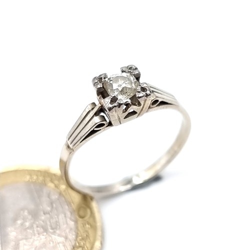 563 - Star Lot : A super vintage diamond solitaire 9K white gold ring, diamond set in a raised claw mount,... 