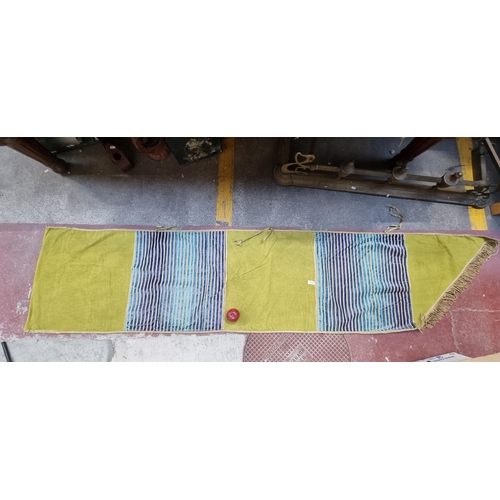 576 - A large and long heraldic banner finished with a fringe trim and featuring a tactile lime green and ... 