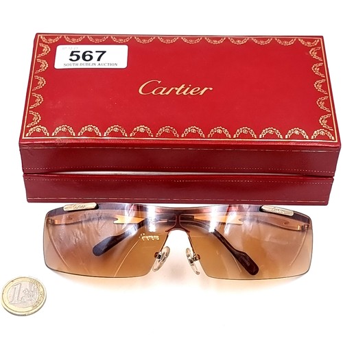 Star Lot A pair of Cartier wrap round single sunglasses with