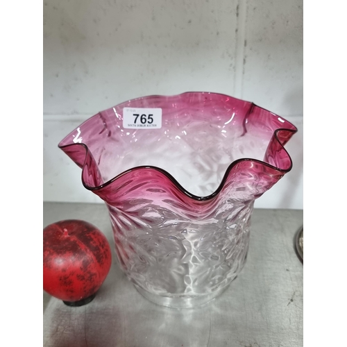 765 - A gorgeous fluted glass oil lamp shade with a cranberry rim and tactile dimpled finish. In a very go... 