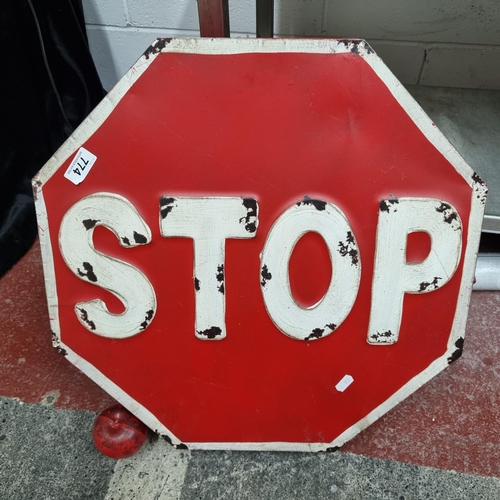 774 - A wall hanging cabinet in the form of a road Stop sign. With front to reveal two shelves and five ho... 