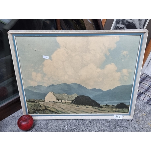 786 - A vintage print of a Paul Henry painting titled 'The Roadside Cottage - Lough Inagh'. Housed in a ch... 