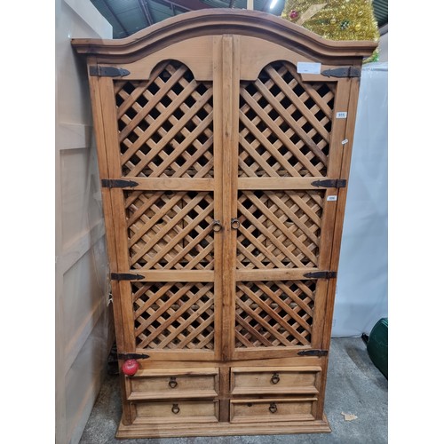 696 - An amazing well crafted Mexican wooden drinks cabinet with holders for stemmed wine glasses, pull dr... 