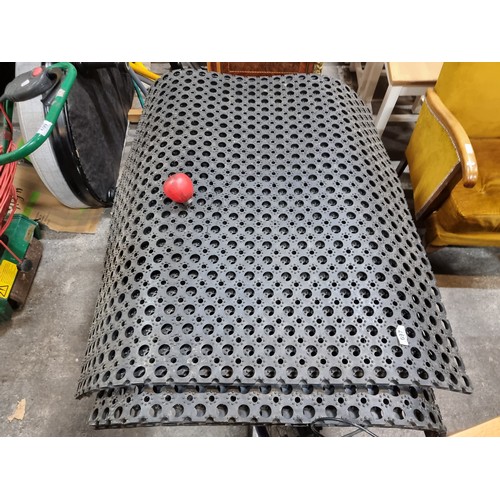 697 - Three large commercial rubber non-slip stress floor mats.