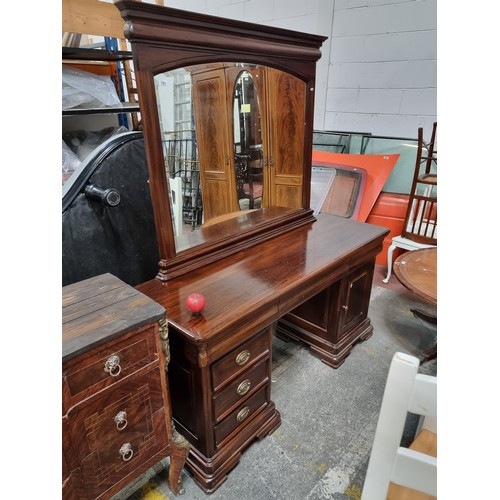 703 - A simply stunning large sit in dresser featuring a magnificent large beveled mirror to top, with thr... 