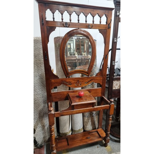 713 - Star Lot : A handsome antique hallway stand with balustrade detail, a beveled mirror in the form of ... 