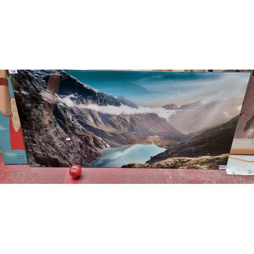 136 - A large photographic print on lucite featuring a mountainous lakeside scene.