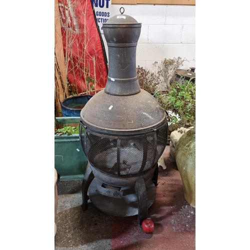 806 - A fabulous large cast metal chimenea garden patio heater.