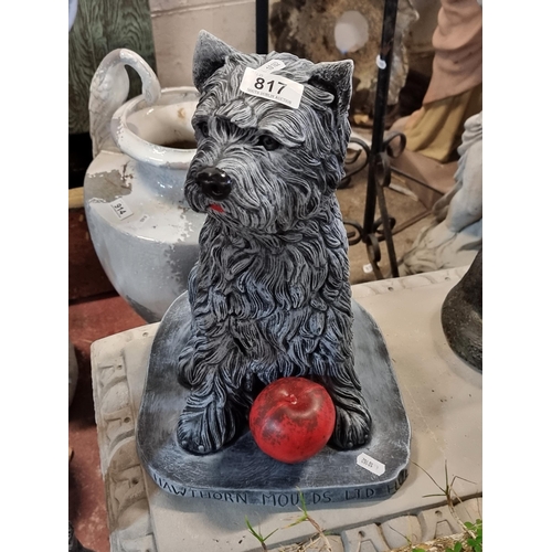 817 - A charming reconstituted stone garden statue in the form of a terrier dog.