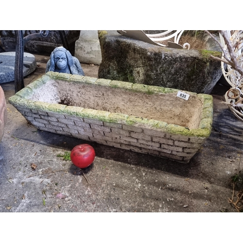 835 - A reconstituted stone trough planter.